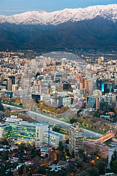 Panoramic view of Providencia district with Mapocho River and the snowed Andes mountain range in the back. photo