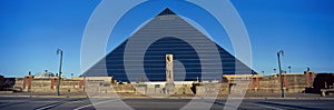 Panoramic view of the Pyramid Sports Arena in Memphis, TN with statue of Ramses at entrance