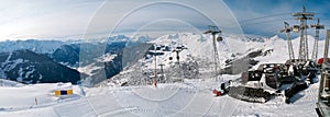 Panoramic view of the Pyrenees and snow plow trucks