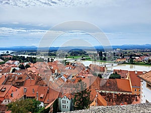 panoramic view - red roofs of houses and Drava river. Town Ptuj. Slovenia