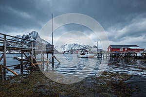 Panoramic view of Reine fishing village at pier and mountain in winter at Lofoten Islands, Norway