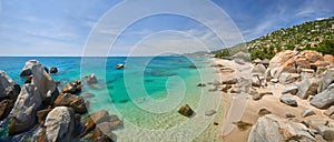 Panoramic view of resort tropical beach with clear water against background of green mountains in south of Vietnam