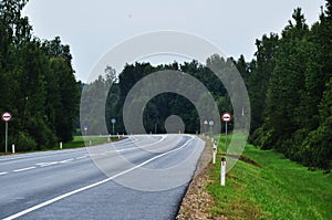 Panoramic view of the road turning through the forest.