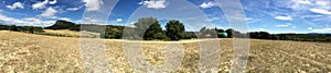 Panoramic view in Rousson, Gard, France with mountains, trees, and prairie