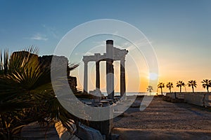 Panoramic view of ruins of ancient Temple of Apollo in Side on sunset, Alanya province, Turkey. Ruined old city. Unesco