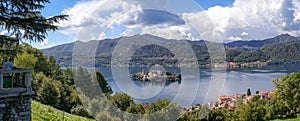 Panoramic view from the Sacro Monte of Lake Orta and the island of San Giulio. Historic Town of Piedmont whose origins date back