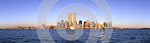 Panoramic view of sailboat on the Hudson River, lower Manhattan and New York City skyline, NY with World Trade Towers at sunset