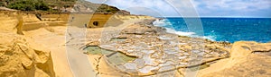 Panoramic view of Salt evaporation ponds, also called salterns or salt pans located near Qbajjar on the maltese Island of Gozo.