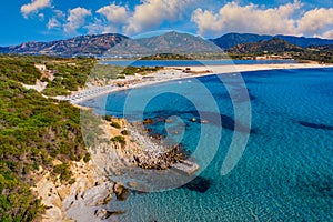 Panoramic view of sandy beach, yachts and sea with azure water, in Villasimius, Sardinia (Sardegna) island, Italy. Holidays, the
