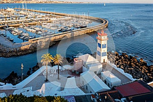 Panoramic view of Santa Marta lighthouse and marina of Cascais, Portugal at sunset