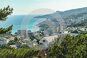 Panoramic view of the sea coast with hotels and buildings, top view, southern coast of Crimea