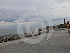 A panoramic view of sea horizon at caorle venice italy city seafront rock