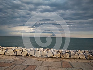 A panoramic view of sea horizon at caorle venice italy city seafront rock