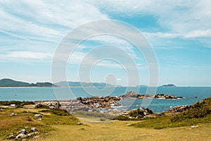 Panoramic view of the sea, in a rocky region, taken from the Armacao Beach, in Florianopolis, Brazil