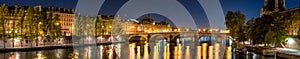 Panoramic view on the Seine River banks, the Pont Royal bridge, and Orsay Museum at dawn. Paris, 7th Arrondissement, France