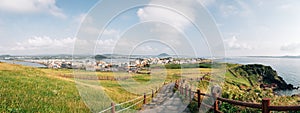 Panoramic view of Seongsan Ilchulbong Tuff Cone seaside walkway in Jeju Island, Korea