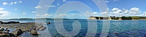 Panoramic view from a shore onto the sea with islands