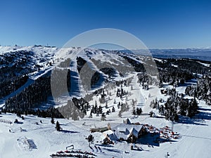 Panoramic view of the ski slope with the mountains and wood. Kopaonic ski resort in Serbia.