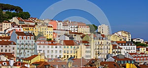 Panoramic view of skyline of Lisbon city, Portugal, many colorful houses against blue sky in the Alfama district photo