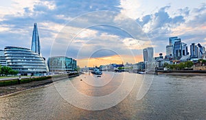 Panoramic view of the skyline of London city from the Tower Bridge at sunset time, United Kingdom.