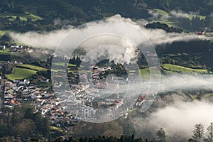 Panoramic view of the small village Furnas in the Sao Miguel island Azores, Portugal; the mist is caused by several natural