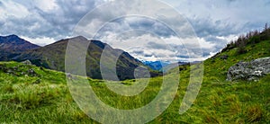 Panoramic view of snow capped southern alps in springtime