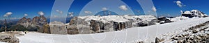 Panoramic view on snowy sella plateau / pordoi peak and boe peak