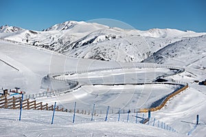 Panoramic view of the snowy slopes at the top of the ski resort of Grandvalira, Pyrenees, Andorra.