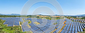 panoramic view of solar power station on hillside