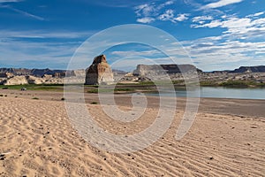 Panoramic view on solitary rock formations Lone Rock in Wahweap Bay in Lake Powell in Glen Canyon Recreation Area, Page