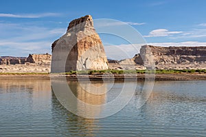 Panoramic view on solitary rock formations Lone Rock in Wahweap Bay in Lake Powell in Glen Canyon Recreation Area, Page