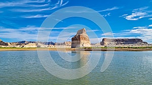 Panoramic view on solitary rock formations Lone Rock in Wahweap Bay in Lake Powell in Glen Canyon Recreation Area, Page