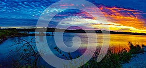 Panoramic view Sports Fishermen at Sunset early fall with beautiful skyline over Ed Zorinsky lake Omaha Nebraska