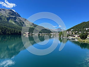 Panoramic view of St. Moritzersee and Alpine resort St. Moritz in Graubuenden, Grisons, Switzerland.