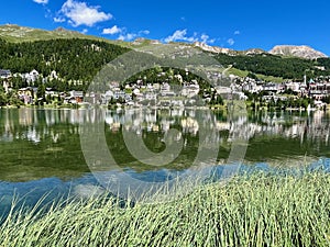 Panoramic view of St. Moritzersee and Alpine resort St. Moritz in Graubuenden, Grisons, Switzerland.