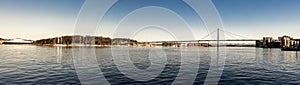 Panoramic view of Stavanger city bridge, marina bay near Grasholmen and Solyst islands and a regular ferry ship