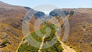 Panoramic view of summer Crete Greek Island near Preveli Lagoon with olive tree plantations mountains and Libyan Sea in