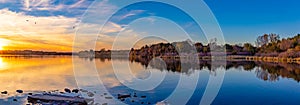 Panoramic view of sunset with beautiful skyline over Ed Zorinsky lake Omaha Nebraska