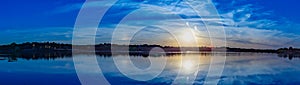 Panoramic view of sunset with beautiful skyline over lake Zorinsky Omaha Nebraska