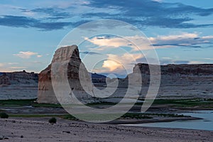 Panoramic view at sunset on solitary rock formations Lone Rock in Wahweap Bay, Glen Canyon Recreation Area, Page, Utah, USA