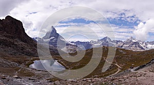 Panoramic view of Swiss Alps with Matterhorn and Riffelsee Lake on the left