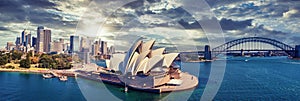 Panoramic view of Sydney city, the harbor bridge and the modern building of the Opera house