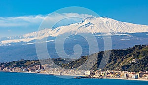 Taormina shore at Ionian sea with Giardini Naxos and Villagonia towns and Mount Etna in Messina region of Sicily in Italy