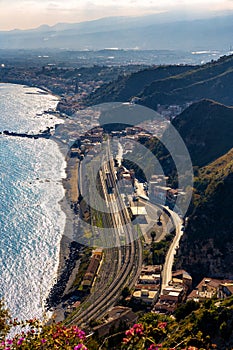 Taormina shore at Ionian sea with Giardini Naxos and Villagonia towns and Mount Etna in Messina region of Sicily in Italy