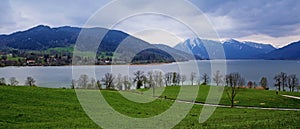 Panoramic view at the tegernsee lake and the blue and snow cover