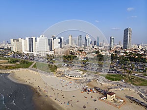 Panoramic view of Tel-Aviv beach and cityscape, Mediterranean sea, Israel. Aerial view of people swiming and lying on the sandy