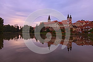 Panoramic view of Telc castle, pond with park, Name of Jesus Church and tower of the Church of St. Jakub