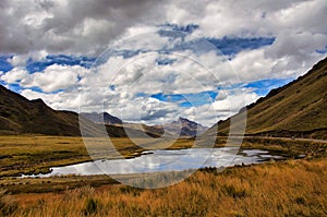 Panoramic view to Andes mountains at Abra La Raya pass with Lake - Puno, Anden, Peru