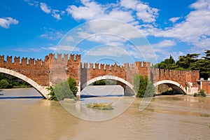 Panoramic view to Bridge Ponte Pietra in Verona on Adige river i