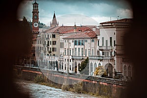 Panoramic view to Bridge Ponte Pietra in Verona on Adige river, Veneto region, Italy. Sunny summer day panorama and blue